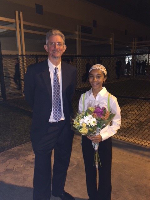 Jayden Noel took a moment to enjoy her accomplishments with Mr. Dunn.