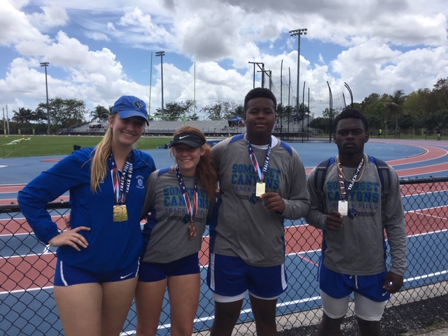 (Left to right) Cara Salsberry, Kassidy Rubin, Tremain Robinson, and Jobed Phanord show off their new medals.