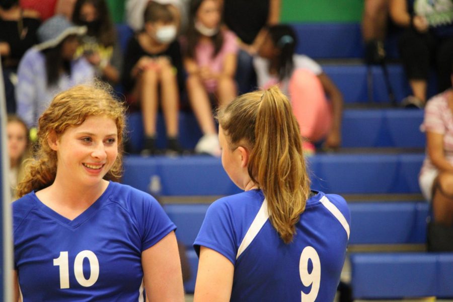 Seniors Rachel Feierstein and Katie Jankun encourage each other on the court in their September 21 game against Olympic Heights.